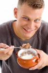 Smiling Man Eating Cornflakes Stock Photo