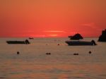 Sunrise In Mediterranean Island Malta, Orange Sky With Boats On A Horizon Stock Photo