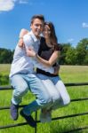 Young Attractive Couple Embracing Each Other On Sunny Day Stock Photo