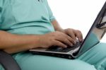 Male Surgeon Working On Laptop Stock Photo