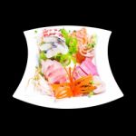 Mixed Sashimi In White Plate Isolated On Black Background,with C Stock Photo