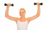Woman Lifts Weights Stock Photo