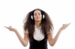 Latin American Female Enjoying Music Stock Photo