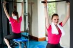 Smiling Female Doing Exercise Stock Photo