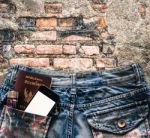 Blue Jeans With Cell Phone, Flashlight And Passport In A Pocket Stock Photo