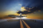 Big Passenger Plane Flying Over Airport Runway Against Beautiful Stock Photo