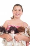 Little Girl With Dolls Stock Photo