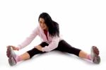 Front View Of Smiling Exercising Woman On White Background Stock Photo