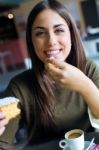 Beautiful Girl Drinking Coffee Sitting Indoor In Urban Cafe Stock Photo