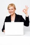 Businesswoman Showing Ok Gesture Stock Photo