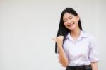 Portrait Of Thai High School Student Uniform Beautiful Girl Pointing Stock Photo