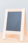 Empty Chalkboard On Wooden Board And Gray Background Stock Photo