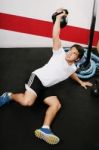 Young Man Lifting Kettlebell Stock Photo