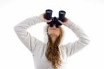 Female Watching Upward Through Binocular Stock Photo