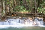 The Water Flowing Over Rocks And Trees Down A Waterfall At Huay Mae Khamin Waterfall National Park ,kanchana Buri In Thailand Stock Photo