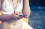 Girl With Smart Phone Near Beach Stock Photo