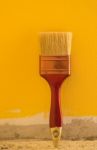 Brush Paint Yellow Color On Cement Wall Backgroundt Stock Photo