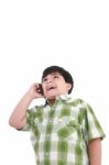 Boy Laughs And Talks With Mobile Stock Photo