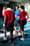 Fit People Working Out In Fitness Centre Stock Photo