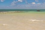 Wooden Pier Dock, Boats And Ocean View At Caye Caulker Belize Ca Stock Photo