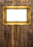 Old Gold Picture Frame On Wooden Background Stock Photo