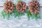 Pine Cones On Wood Background Stock Photo