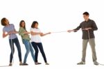 Teenagers Playing Tug Of War Stock Photo