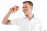 Smiling Man Holding Apple Stock Photo