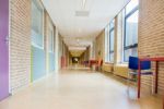 Long Corridor With Furniture In School Building Stock Photo