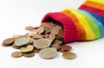 Coins Spill From Wool Pouch  Stock Photo