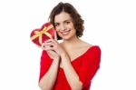 Woman Closely Holding Gift From Her Boyfriend Stock Photo