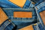 Leather Label On Jeans Background Stock Photo