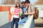 A Group Of Friends Talking In The Street After Class Stock Photo