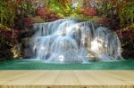 Perspective Window View Of Waterfall With Autumn Forest Stock Photo