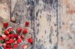 Strawberries On Wooden Floor Stock Photo