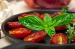 Baked Cherry Tomatoes With Basil And Thyme Stock Photo