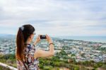 Woman Using Phone Taking Pictures Stock Photo