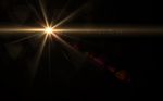 Abstract Sun Burst With Digital Lens Flare Light Black Background Stock Photo