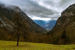 Autumn Valley In The Alps With Sunlight Breaking Through Stock Photo