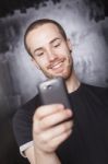 Young Male reading sms Stock Photo