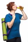 Curvy Woman Carrying Yoga Mat Stock Photo