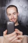 Male Holding Smartphone Stock Photo