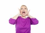 Woman Shouting With Hands On Ears Stock Photo