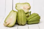 Chayote Fruit On White Wood Background Stock Photo