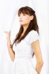 Brunette Near White Curtain Stock Photo