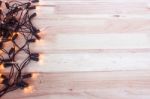 Christmas Lights,garland Lights On Wooden Background Stock Photo