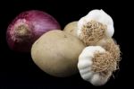 Vegetables. Potatoes, Garlics And Onion Stock Photo