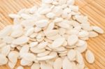 Pumpkin Seeds On Kitchen Bamboo Mat Stock Photo