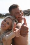 Smiling Couples Thumb Up Stock Photo