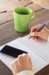 Working Creative Table And Hot Green Tea Drinking Stock Photo